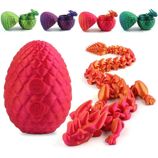 Crystal Dragon Studio articulated red dragon emerging from its egg, showcasing intricate detail.