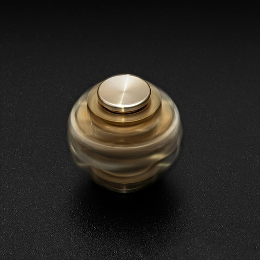BrassGear Fidget Spinner held in hand, illustrating compact size and ergonomic design for adults and teens.
